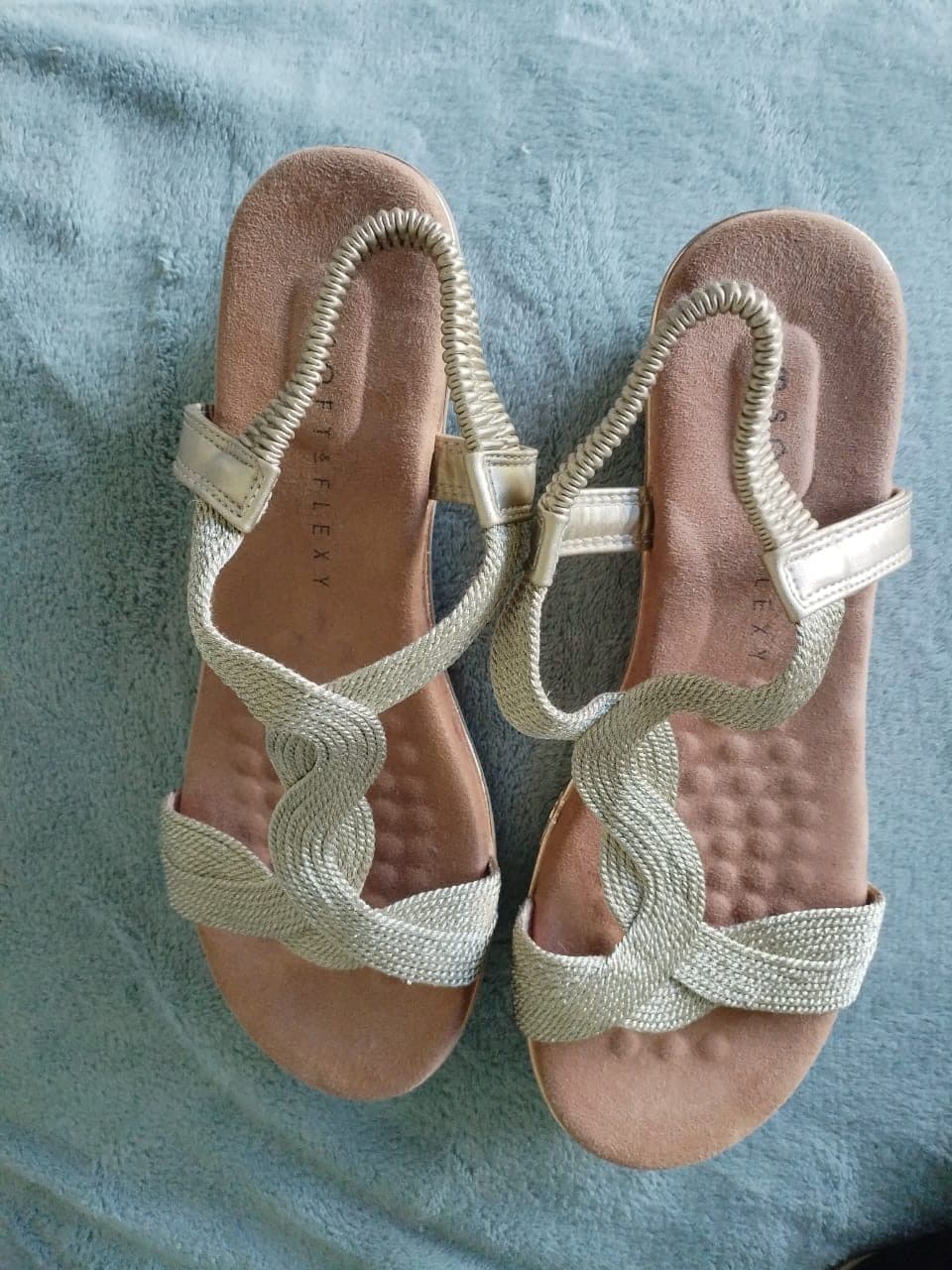 Gold woven twist flat sandals with elastic slingback