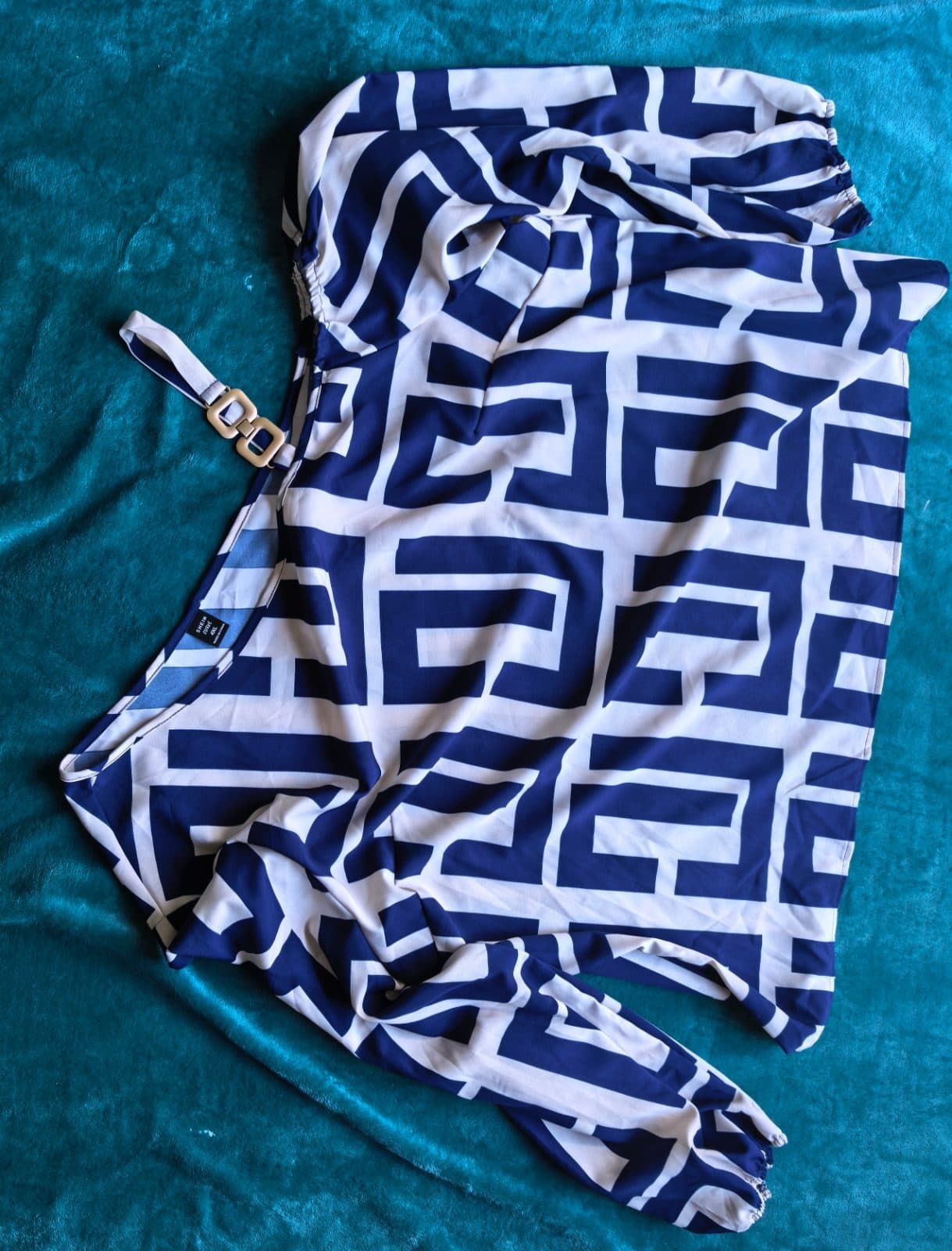 Navy and white geometric print balloon-sleeve blouse