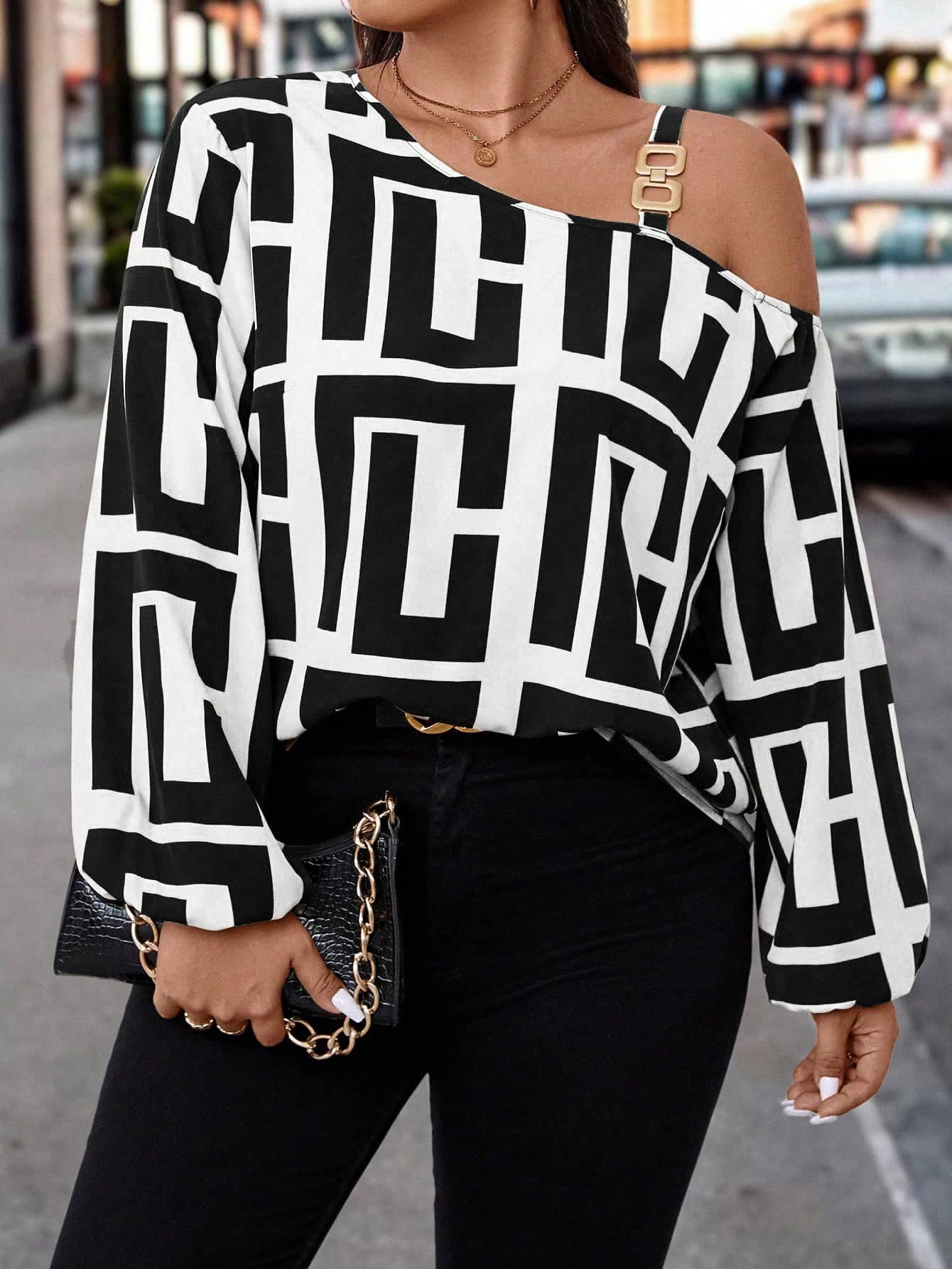 Black and white geometric print asymmetric neckline blouse